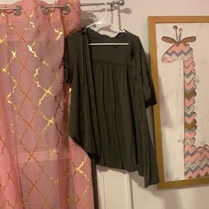 Dark green shirt from torrid it really isn’t my style so that is why I’m selling